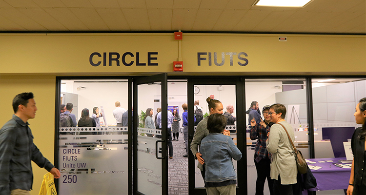 Photo of people walking around inside the CIRCLE office
